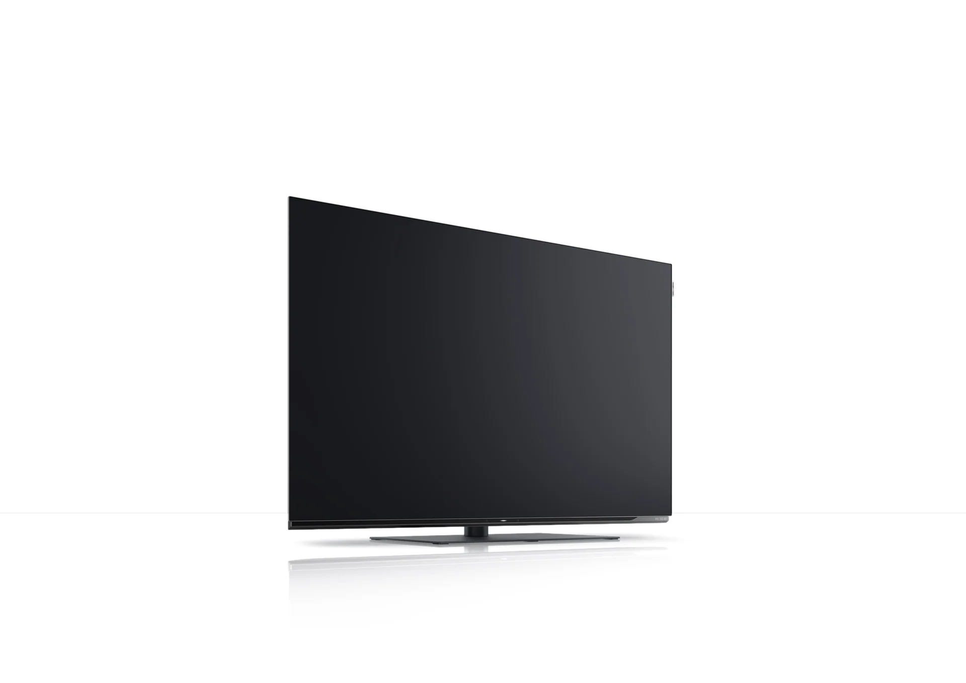 Loewe We SEE 4K OLED 48 Smart TV, angled side view on table stand at Toma Audio